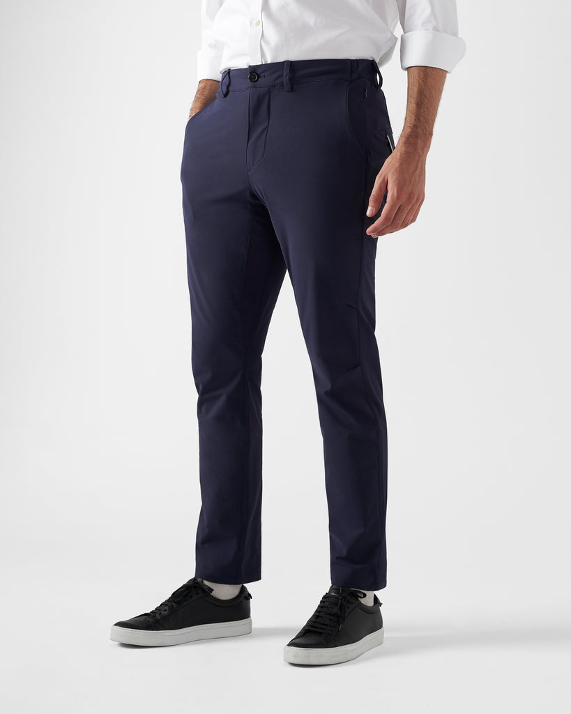 The Navy Ones | Performance-Wear Brand | Buy Performance-Wear M1LE | Navy chino office wear mens trousers paired with black leather sneakers and a smart work shirt.