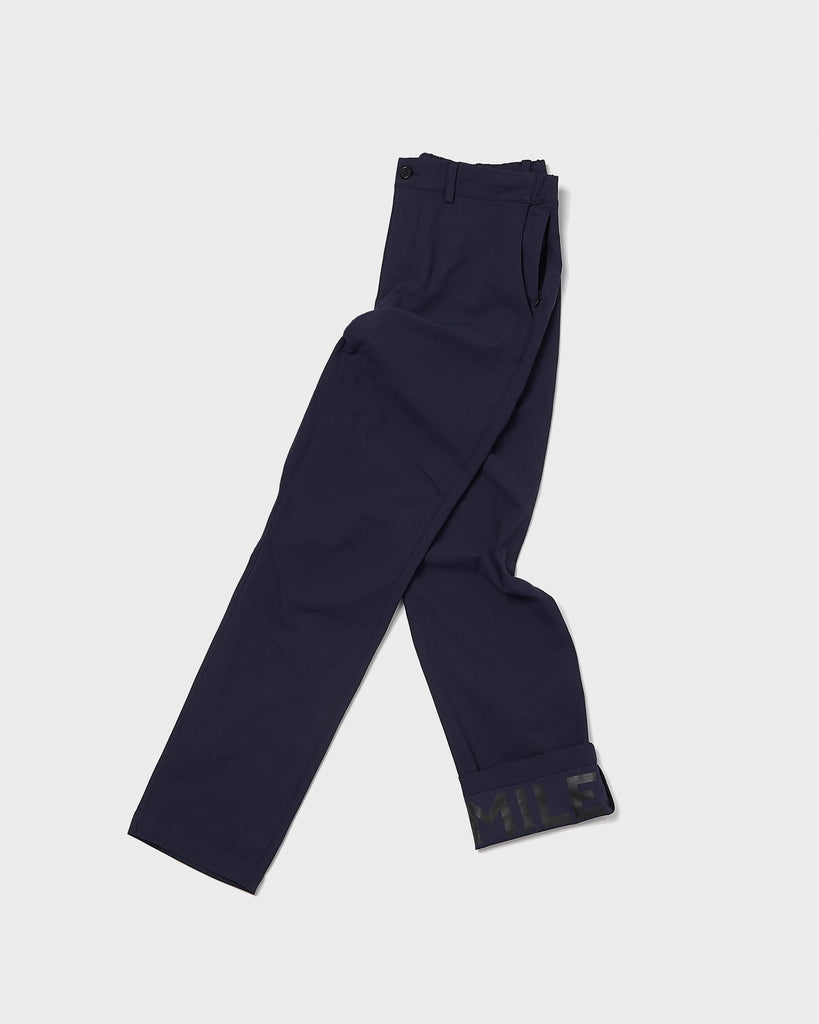 A birds eye view (flat-lay) of the navy commuter trousers